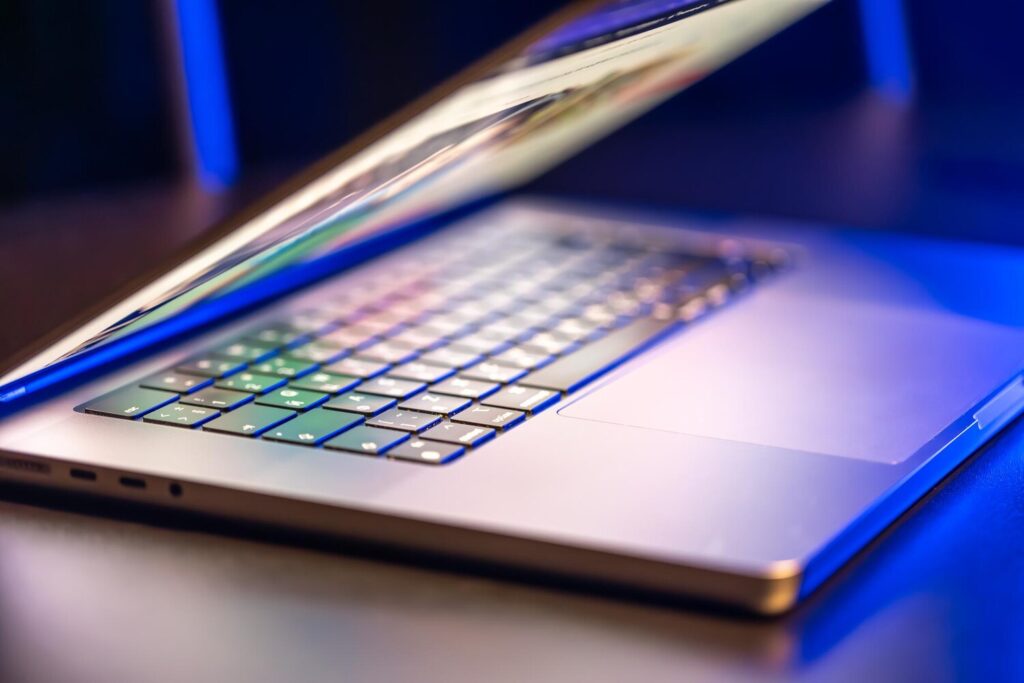 laptop computer with halfopen screen dark background 169016 63439