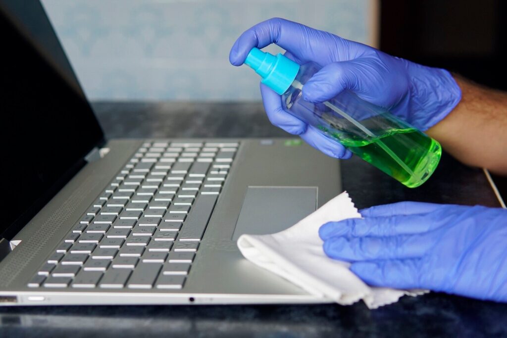 prevention covid 19 coronavirus protection from microbes viruses man panic cleaning notebook laptop pc cleaning dust from keys gray keyboard 431724 1566 prevention covid 19 coronavirus protection from microbes viruses man panic cleaning notebook laptop pc cleaning dust from keys gray keyboard 431724 1566