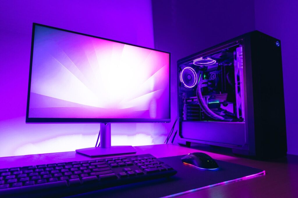 modern gaming computer setup with display water cooling case keyboard mouse gaming mat purple led light background 176814 1008
